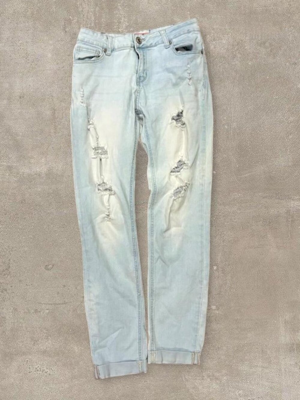 2010s light blue ripped millennial skinny jeans with custom anti-gap tailoring
